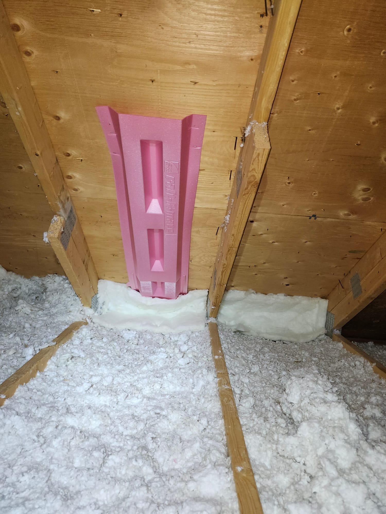 A rafter baffle at the eave keeps intake air flowing over the new insulation.