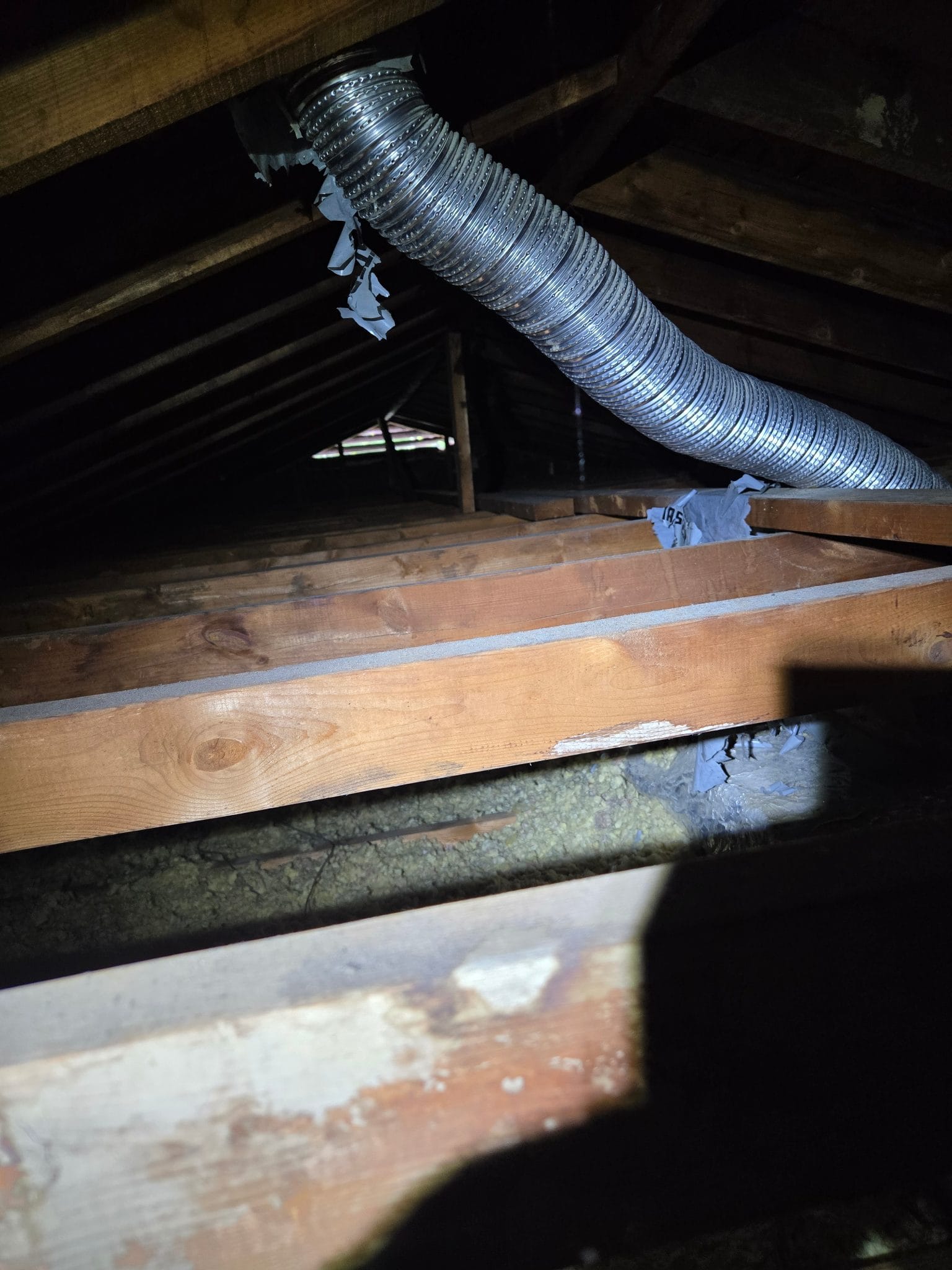 The before overview: thin coverage under a stained deck — the two problems that always travel together.