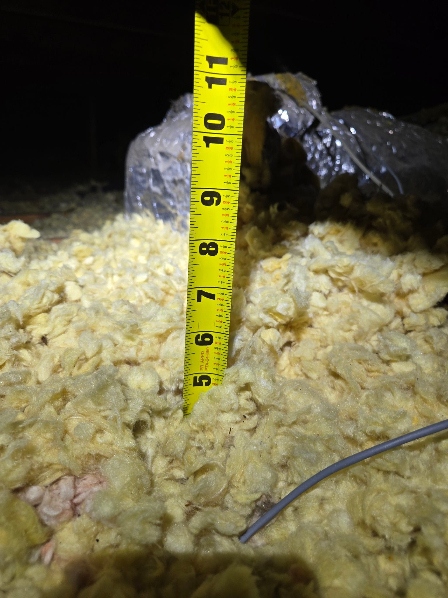 The depth reading: about 5″ of decades-old material.