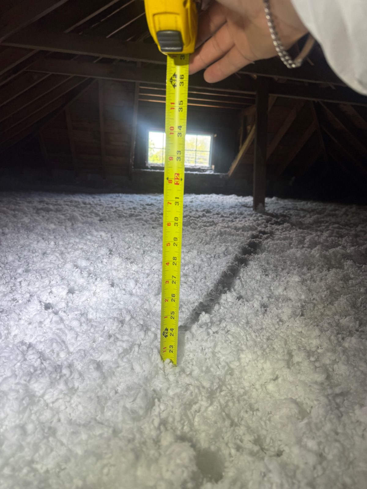 Depth without suffocation: 22″ of insulation, possible because the eaves were baffled first.