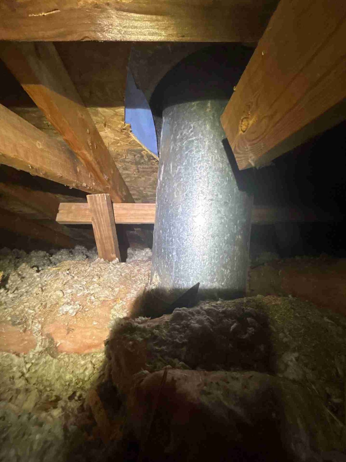 Ductwork passing through the attic &mdash; every joint a potential moisture leak into the cold zone.