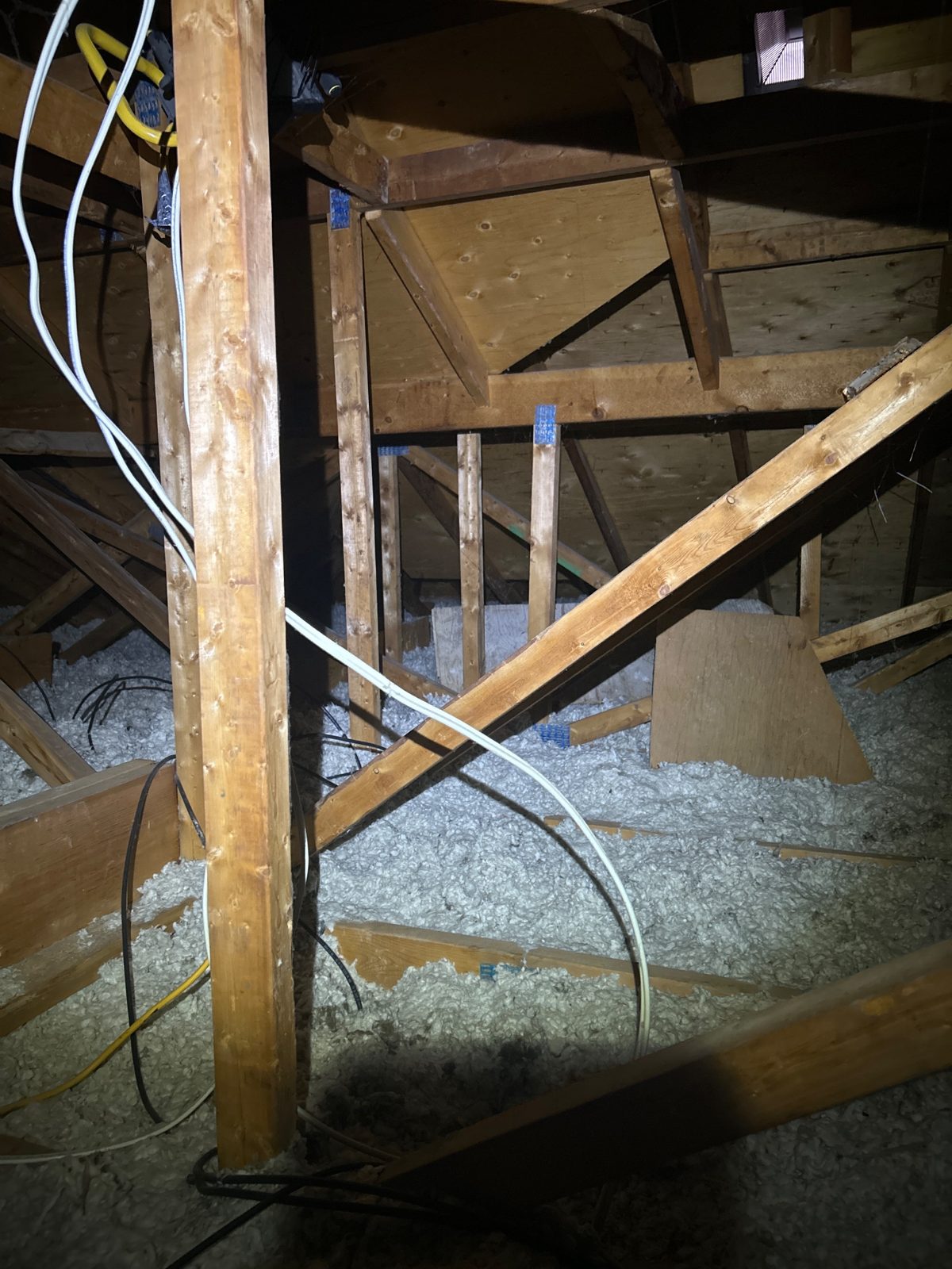 A big, bright truss attic — with far too little insulation in it.