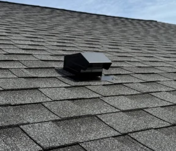 A dedicated bathroom exhaust roof cap with its insulated duct — appliance exhaust done right.